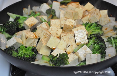 Add firm tofu cut into bite-size chunks to the sautéed vegetables