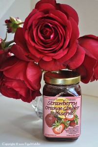 Jar of Strawberry-Orange-Ginger jam with red rose bouquet