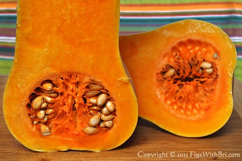 sliced butternut squash cavities are packed with seeds
